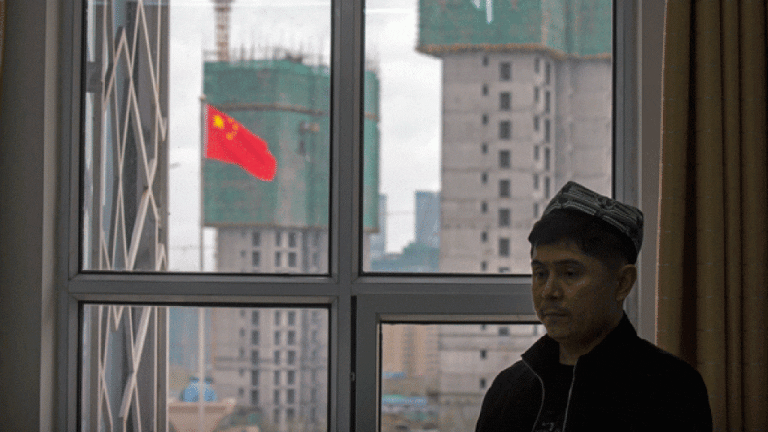 a-uyghur-instructor-stands-near-a-window-during-a-class-at-the-xinjiang-islamic-institute-copy