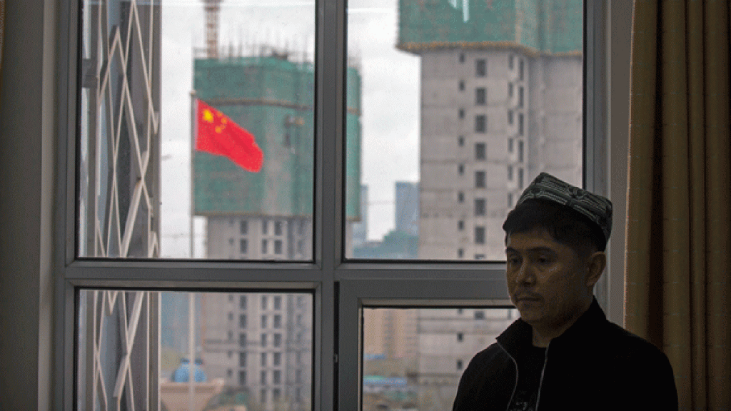 a-uyghur-instructor-stands-near-a-window-during-a-class-at-the-xinjiang-islamic-institute-copy