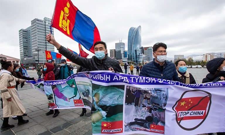protesters-in-ulaanbaatar-the-capital-of-mongolia-hold-banners-and-wave-the-mongolian-flag-during-a-protest-against-chinese-policies-in-the-neighboring-chinese-province-of-inner-mongoli-1