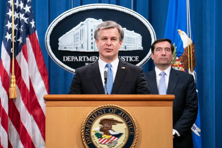 FBI director Christopher Wray, right, and John Demer